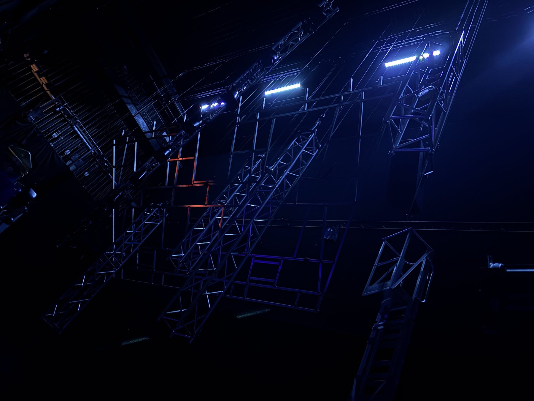 The Government Inspector scenic truss structure under blue light